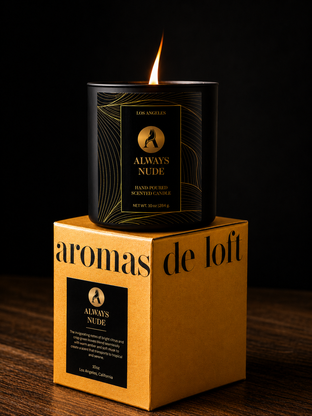 Candle labeled 'Always Nude' on top of its packaging box with a dark background