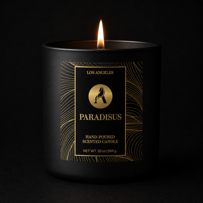 Black candle with gold label on a black background