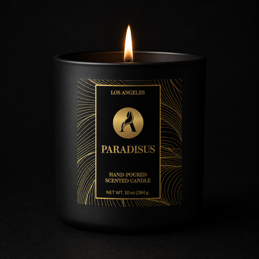 Black candle with gold label on a black background